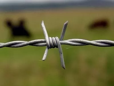 Farm barbed wire fence