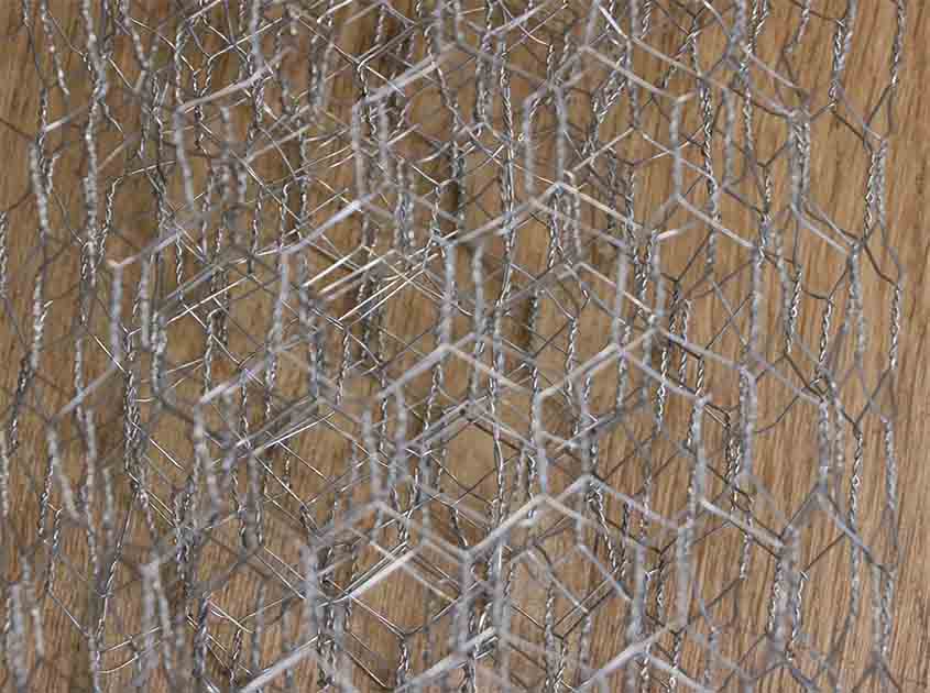 What are the installation considerations for chicken wire mesh on different surfaces